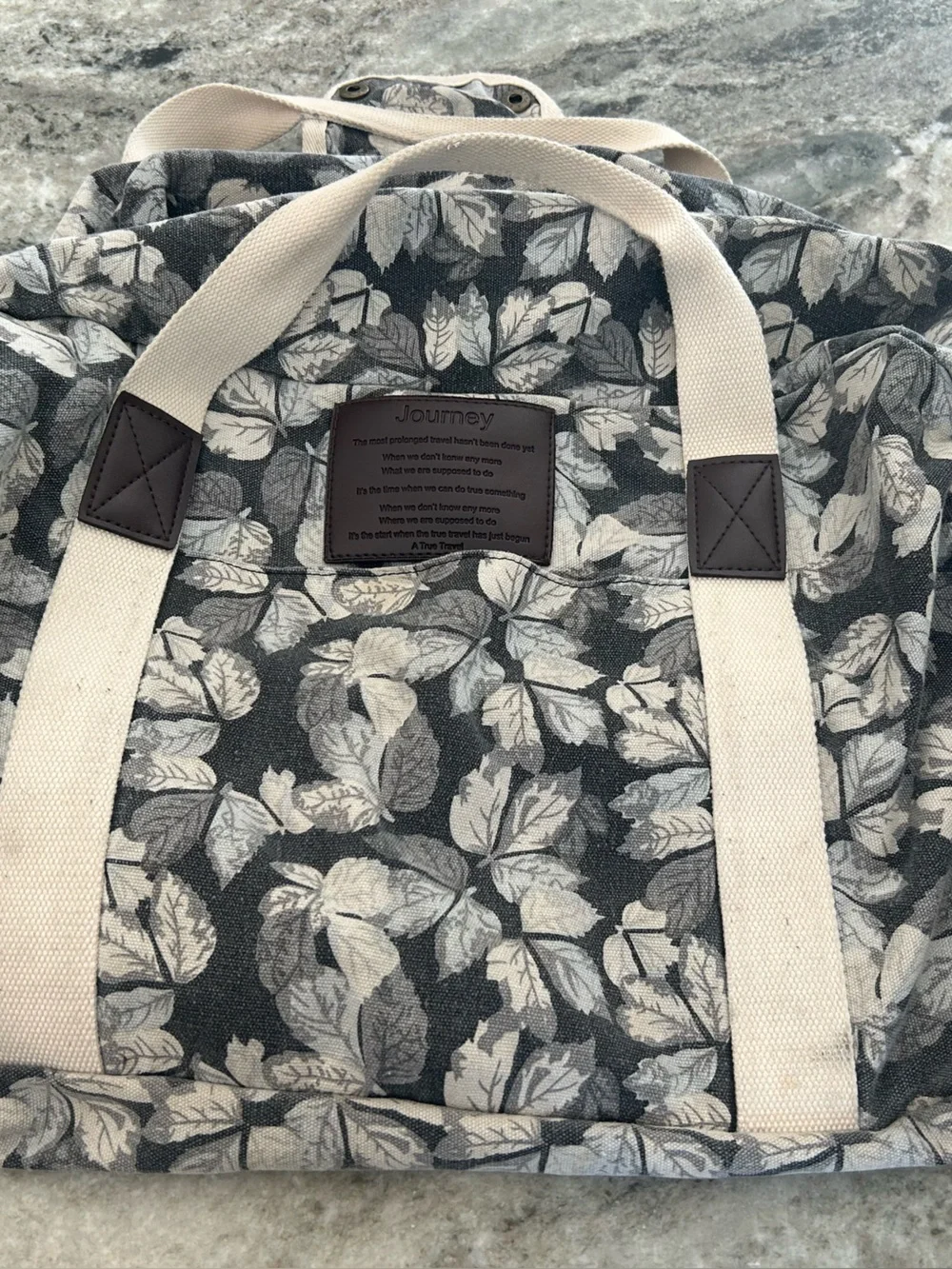 Journey Canvas Leaf-Print Tote Bag in Gray measures approximately 12x20 inches